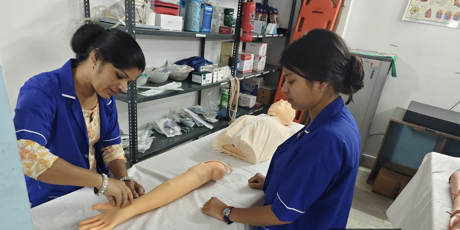 Healthcare trainees practising clinical skills using a training mannequin